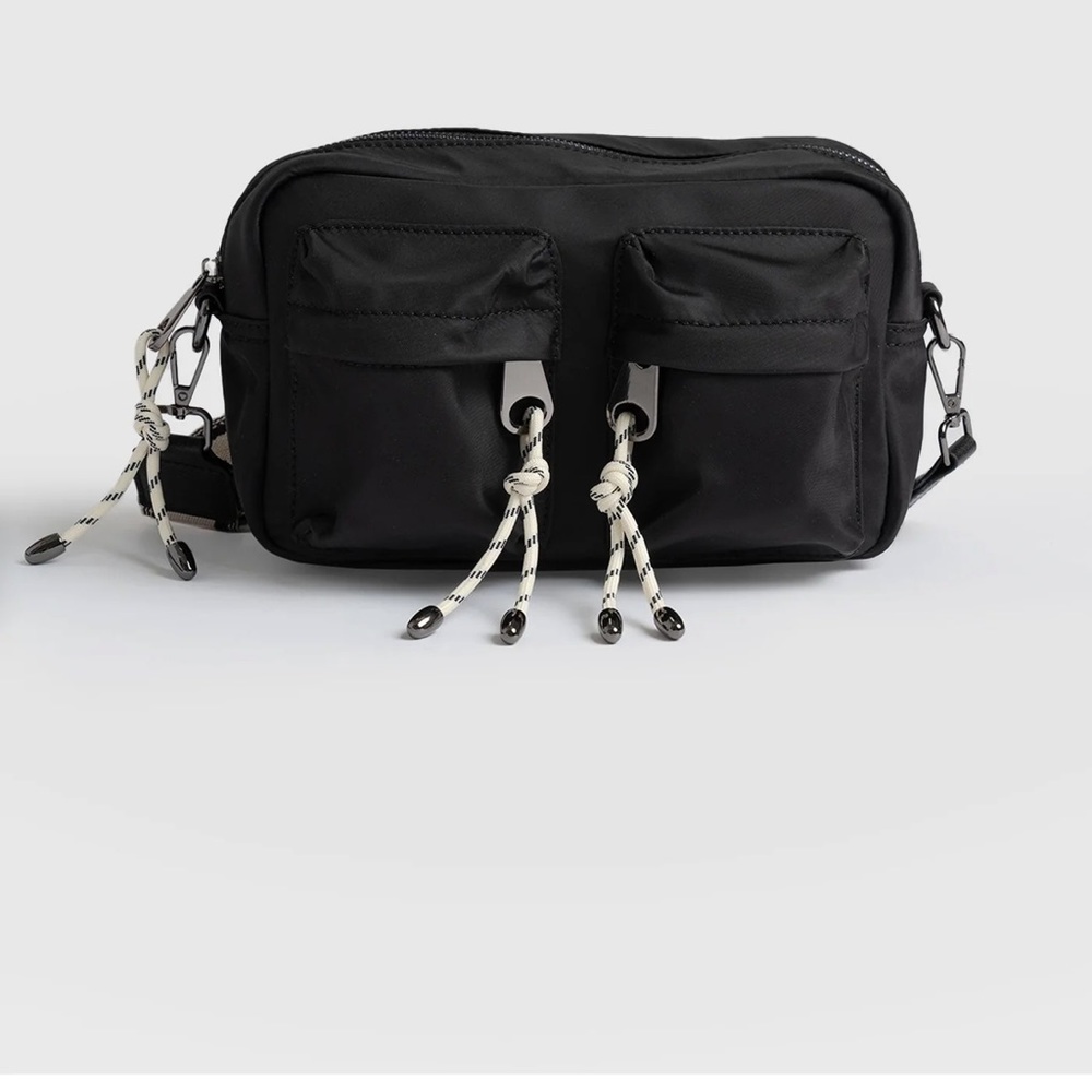 Saint Sophia crossbody bag. Black with tassels.